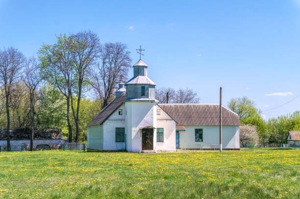 istock Old country church and spring meadow 1317304701