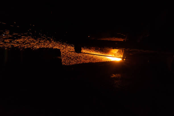 istock Spatter of Hot Molten Metal During Cast Iron Piercing. 1317305501