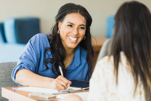 istock Confident businesswoman talks with colleague 1317309421