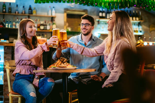 istock Friends cheers with beer in pub 1317309706