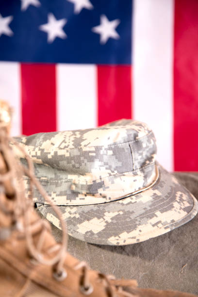 istock US Military Display.  Modern day military boots and cap. 1317310722