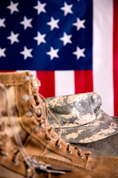 istock US Military Display.  Modern day military boots and cap. 1317310749