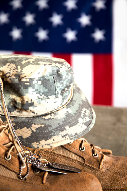 istock US Military Display.  Modern day military boots and cap. 1317310777