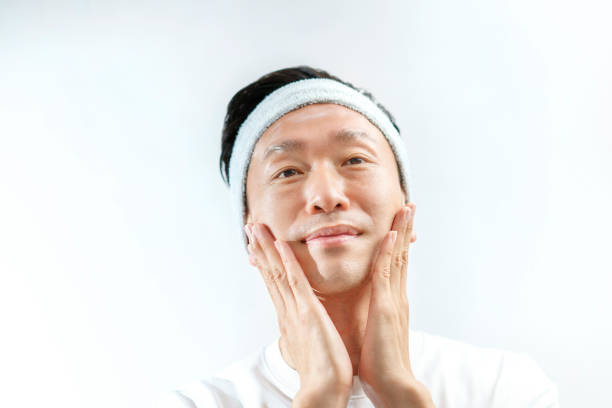 istock A man who applies cream to his face 1317312051