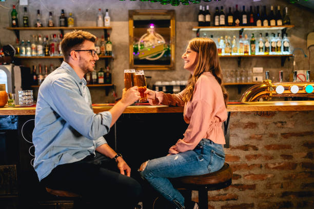 istock Young man and woman on first date in pub 1317312571