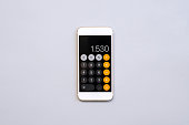 smart phone with calculator on gray background