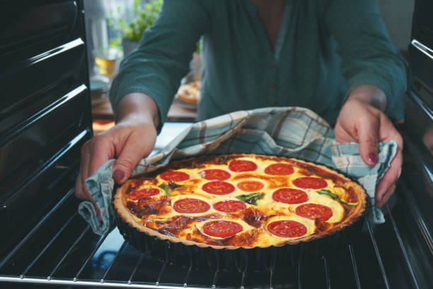 istock Preparing Quiche Lorraine with Tomatoes and Bacon 1317317965