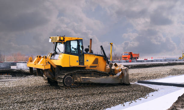 istock yellow bulldozer is carrying out road construction works 1317318046
