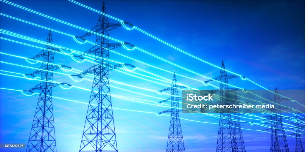 Electricity transmission towers with glowing wires High voltage transmission towers with glowing wires against blue sky - Energy concept Fuel and Power Generation Stock Photo