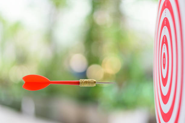 istock Target or a dartboard, a bullseye marked with numbers, a red dart or arrow points toward a target. 1317323585