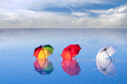Colorful umbrellas on the water. Salt Lake in Turkey