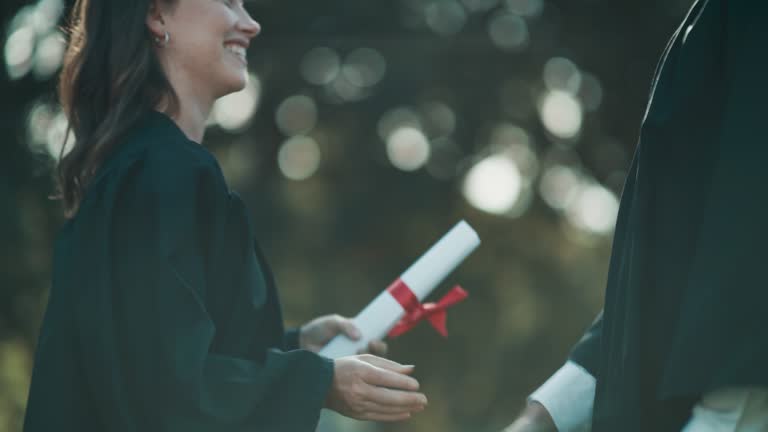 4k video footage of a student receiving her diploma on graduation day