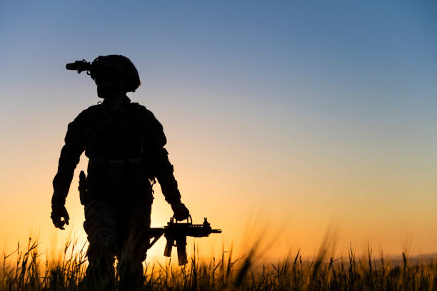 istock Soldier walking in battlefield at sunset 1317330696
