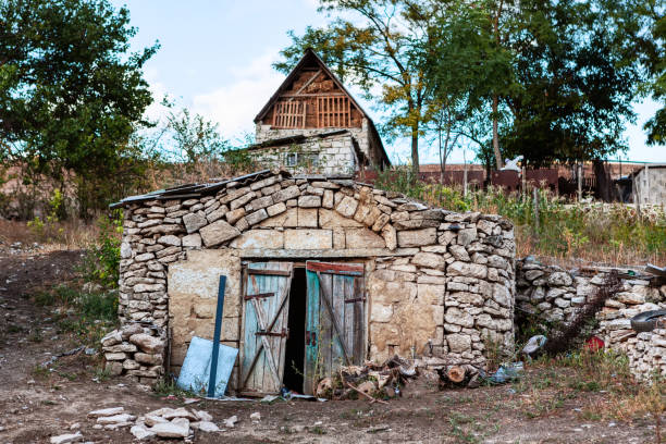 Archaic cellar in the country . Old building for keeping products underground