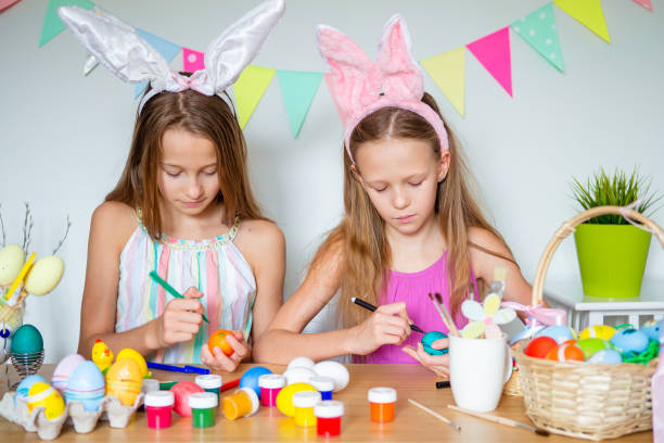 istock Happy easter. Beautiful little kids wearing bunny ears on Easter day. 1317331062