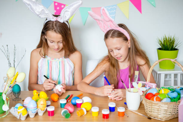 istock Happy easter. Beautiful little kids wearing bunny ears on Easter day. 1317331152