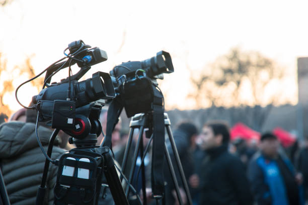 istock Covering an event with a video camera 1317332070