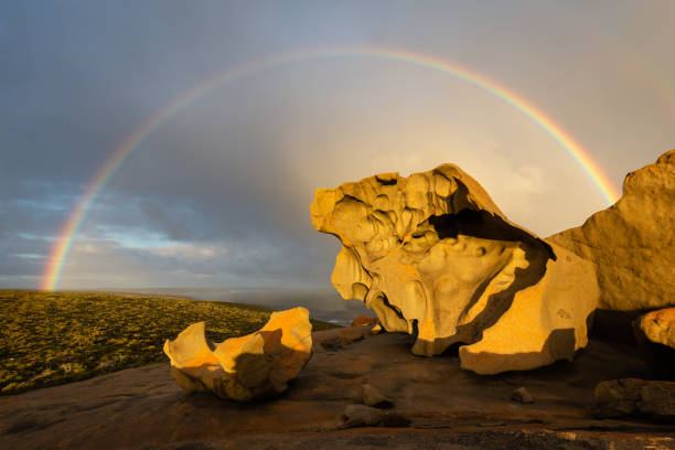 Remarkable Rocks with a rainbow at sunset. Remarkable Rocks with a rainbow at sunset in Flinders Chase National Park, Kangaroo Island, Australia. flinders chase national park stock pictures, royalty-free photos & images