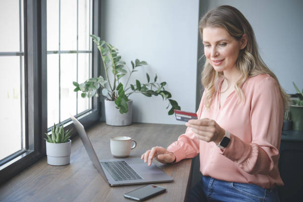 istock attractive middle aged woman working in the office ( Online Shopping) 1317333346