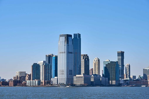 The skyline of the Exchange Place neighborhood of the Jersey City Waterfront. Looking across New York Harbor, photographed from the Staten Island Ferry.