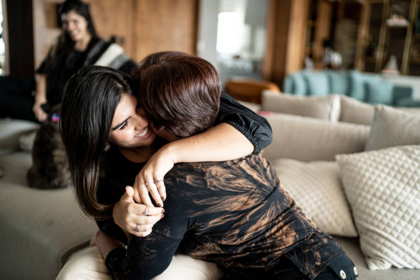istock Mother and daughter embracing at home 1317334607