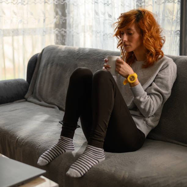 istock Young redhead woman drinking coffee in the morning 1317337088