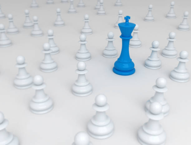 istock Blue chess king standing out - Business conceptual background 1317337754