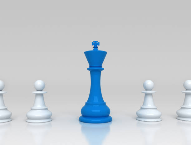 istock Chess pieces with blue king center 1317337762