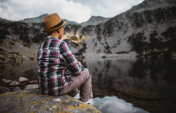 istock Sitting on rock in the mountains 1317337808
