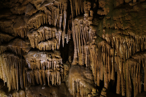Gumushane, Turkey-July 26, 2018: Karaca Cave in Gumushane. There are many natural wonders in the cave such as dripstone shapes, stalactites, stalagmites, columns, org-patterned walls, cave flowers, cave pearls and travertine steps.
