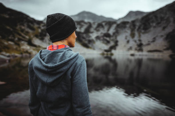 istock Exploring lake in the mountains  at overcast weather 1317337917