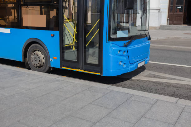 istock city bus goes along street 1317340207