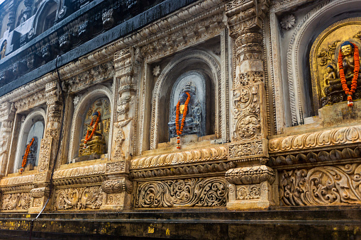 This August 18, 2016 photo shows the Mahabodhi Temple in Bodh Gaya, Bihar, India, one of the most significant sites in Buddhism. It's believed Buddha reached enlightenment while sitting under the Bodhi Tree at this complex. Statues of Buddha line the exterior of the temple.