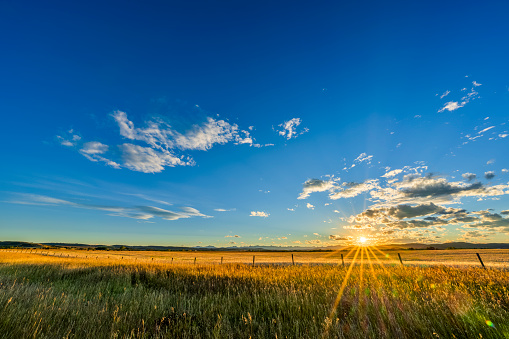 Sunset in hay field in rural Alberta, Canada