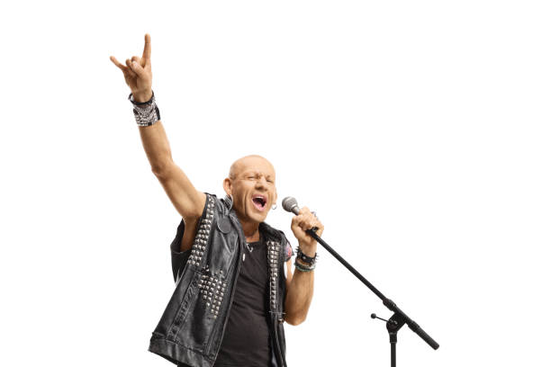 istock Rock star singing on a microphone and gesturing rock and roll sign 1317349106