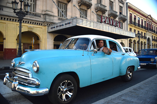 Havana, Cuba, UNESCO World Heritage Site- August, 2016: City center traffic jam with local Cuban giving a thumbs up in good spirits.
