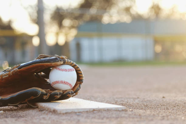 istock Baseball in glove on field 1317351087