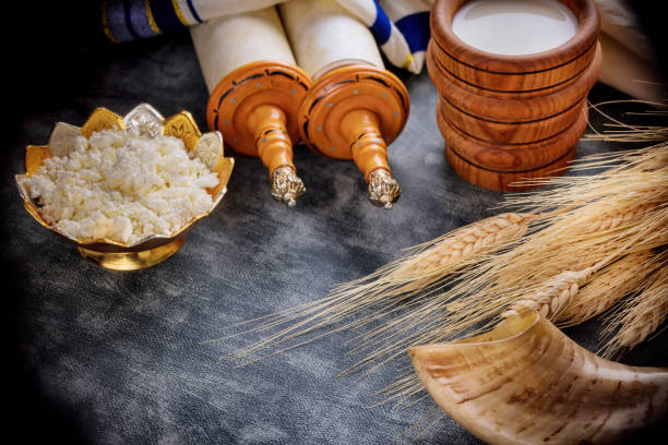 Jewish holiday Shavuot concept in the kosher dairy food on harvest season Traditional Jewish holiday Shavuot in the kosher dairy food on harvest season simchat torah photos stock pictures, royalty-free photos & images