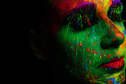 girl painted with neon paint