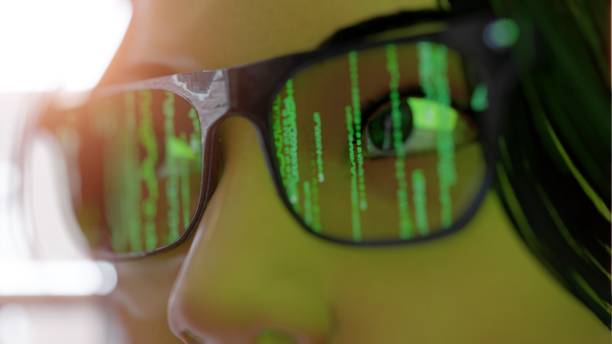 istock Woman wearing modern spectacles  Smart glasses and reality concept with Matix screen. Virtual technology. Close up of eye surrounded by  statistics and  apple analytics 1317361397