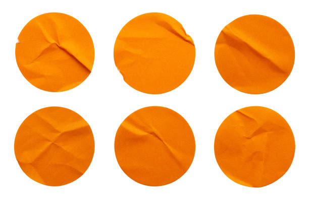 istock Blank orange round adhesive paper sticker label set collection isolated on white background 1317361431