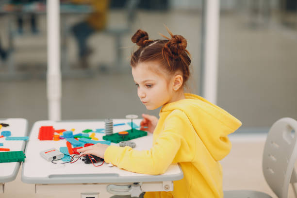 istock Little girl kid child constructor checking technical toy. Children Robotics constructor assemble robot. 1317361703