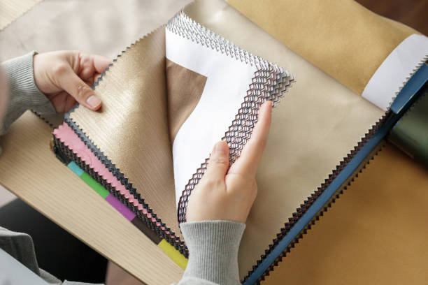 istock female designer with fabric color samples choosing textile for curtains 1317361834