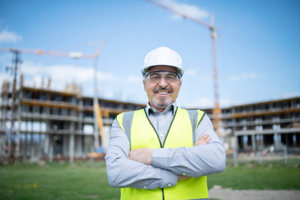 istock Portrait of successful architect in front of construction site. 1317362613