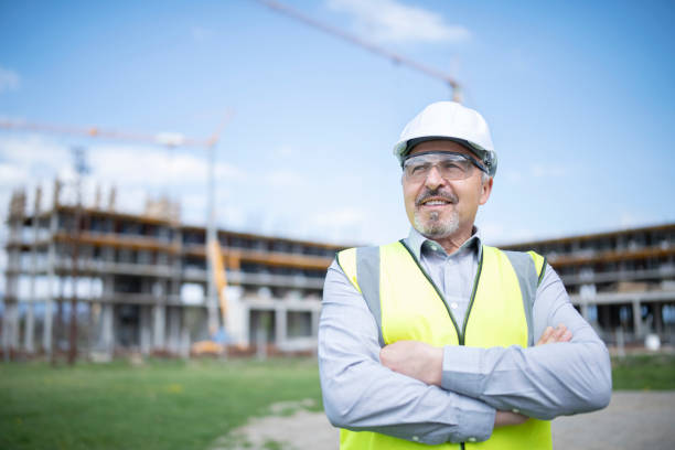 istock Portrait of successful architect in front of construction site. 1317362618