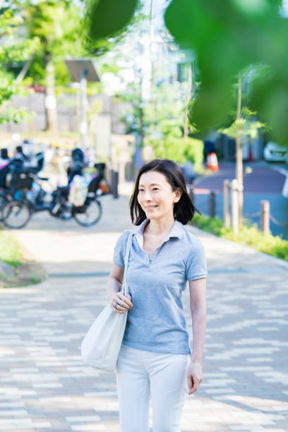 istock Middle-aged woman taking a walk with a relaxed look 1317369545