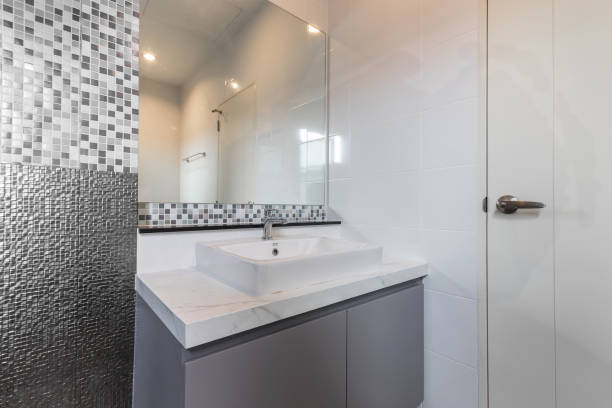 istock Close-up small basin and mirror in small bathroom, On Mosaic wall. 1317374245