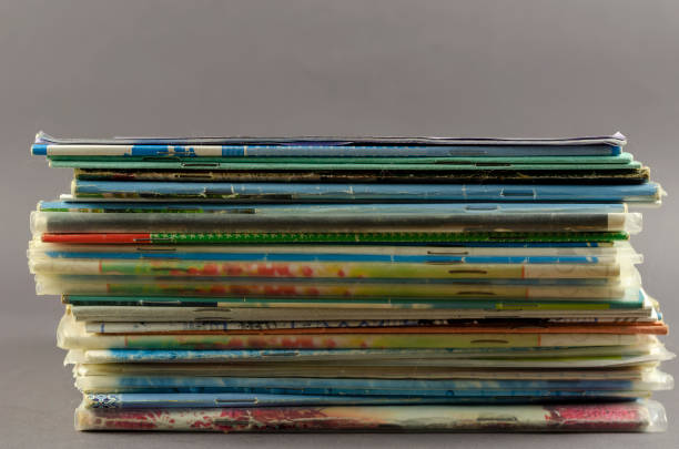 istock Stack of old school exercise books on a gray background. 1317374942