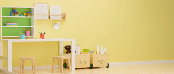 istock Kid room interior design with study table, stationery, shelf and playthings in the room with yellow pastel wall, 3D rendering 1317375635