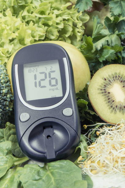 istock Glucometer with sugar level, fruits, vegetables and sprouts. Nutritious healthy eating containing minerals and vitamins during diabetes 1317378484